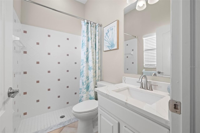 bathroom featuring a shower with curtain, vanity, toilet, and tile patterned floors