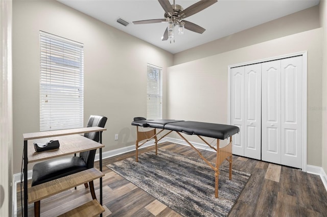 office with ceiling fan and dark hardwood / wood-style flooring