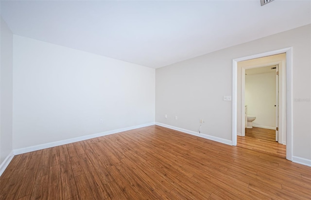 unfurnished room featuring wood-type flooring