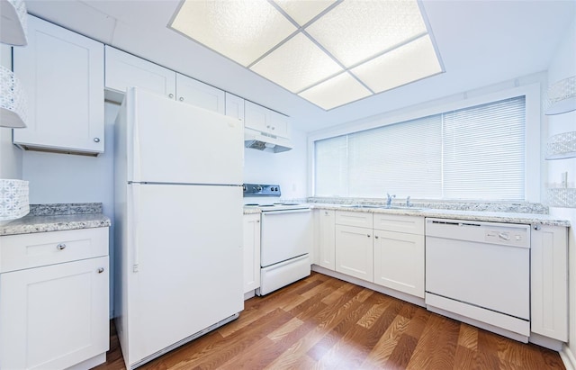 kitchen featuring white cabinets, wood-type flooring, white appliances, and sink