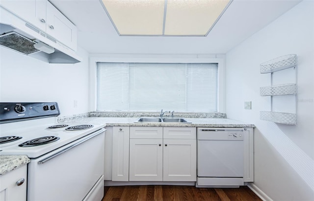 kitchen featuring white cabinets, white appliances, dark hardwood / wood-style floors, and sink