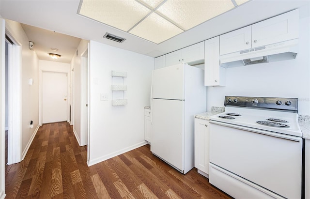 kitchen with white appliances, dark hardwood / wood-style floors, and white cabinetry