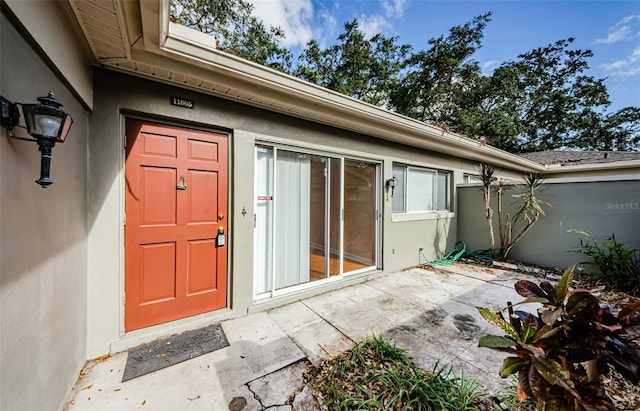 property entrance with a patio area