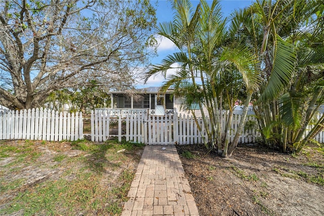 view of front of house featuring a sunroom