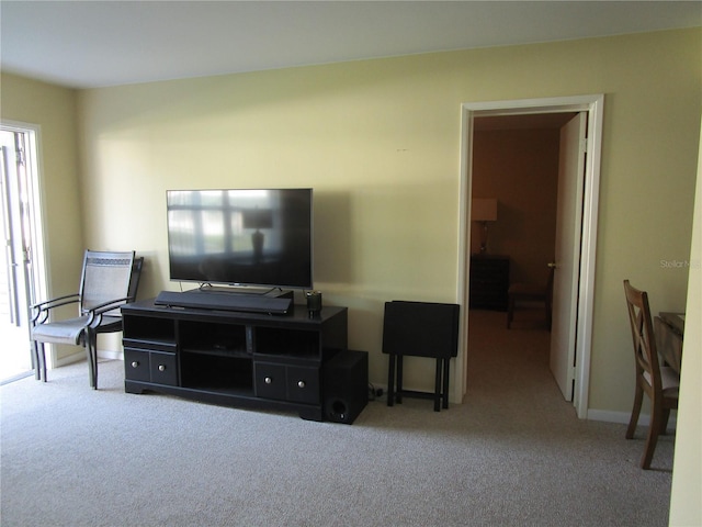 living room featuring light carpet