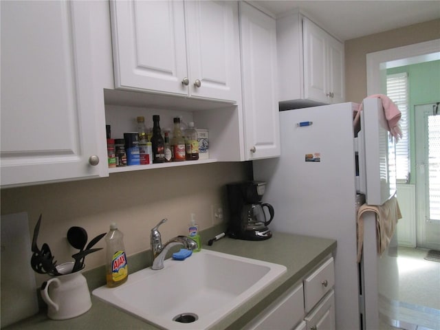 kitchen with white cabinets and sink