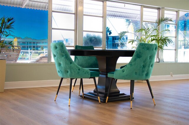 dining area with wood-type flooring