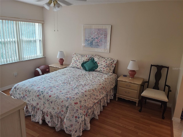 bedroom featuring light hardwood / wood-style floors and ceiling fan