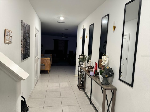 hallway with light tile patterned floors