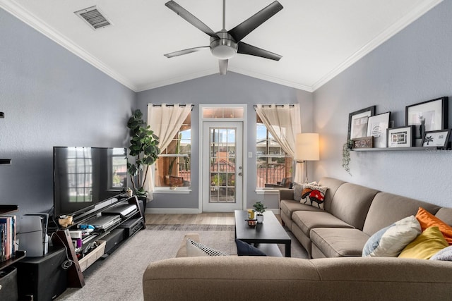 living room featuring light hardwood / wood-style floors, ceiling fan, vaulted ceiling, and crown molding