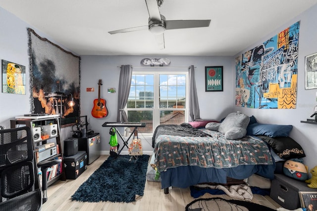 bedroom featuring ceiling fan and light hardwood / wood-style flooring