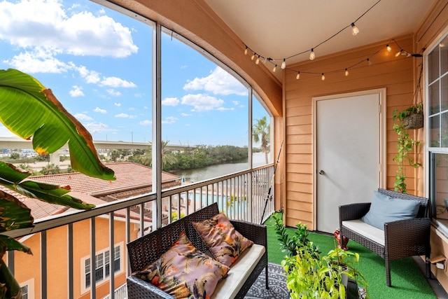 sunroom with a water view