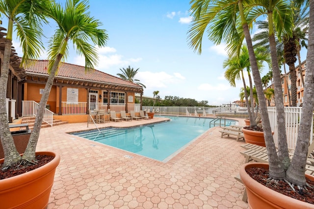 view of pool featuring a patio area