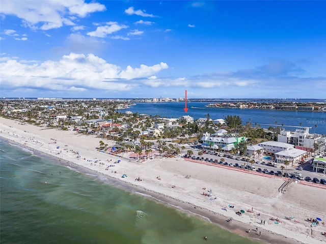 birds eye view of property featuring a water view and a beach view