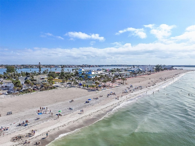 drone / aerial view featuring a view of the beach and a water view