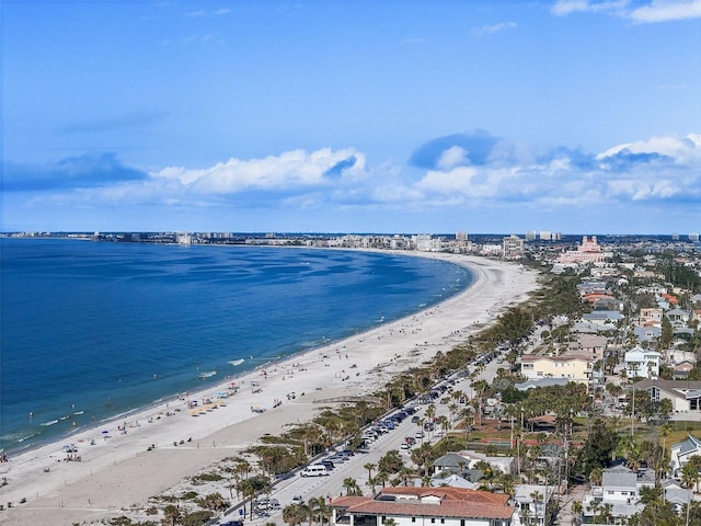 bird's eye view with a water view and a beach view