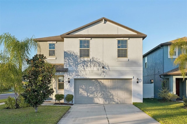 view of front of property with a front yard and a garage