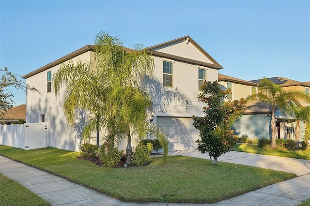 view of front facade featuring a front lawn and a garage