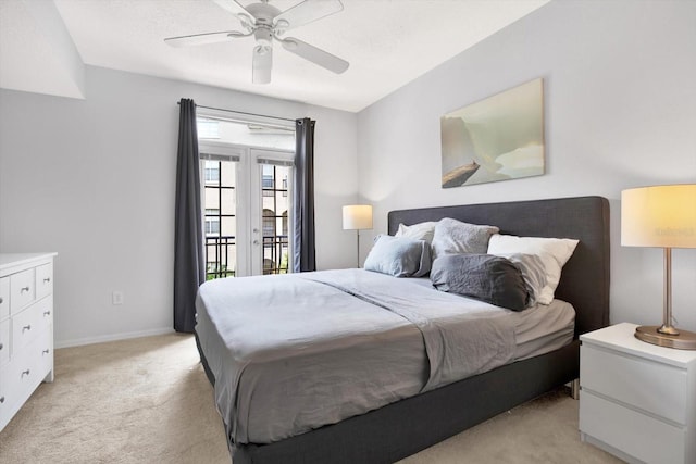 bedroom with ceiling fan, access to exterior, light carpet, and french doors