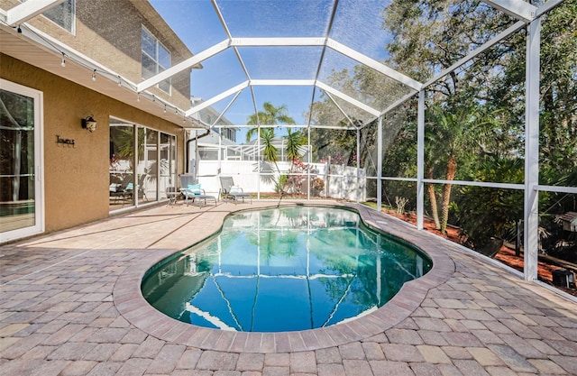 view of pool featuring a lanai and a patio area