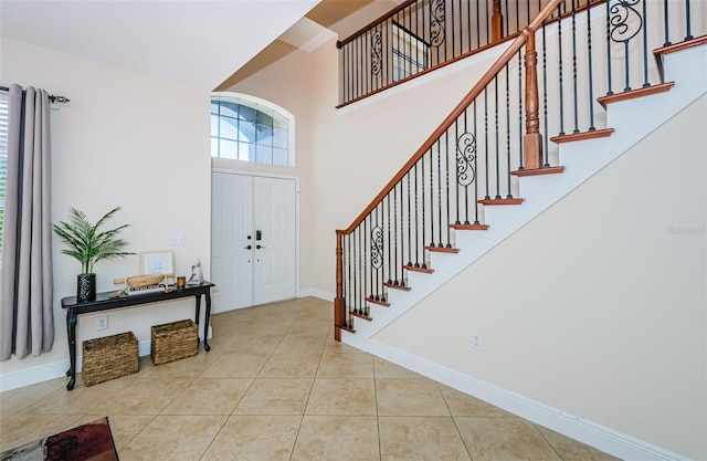 foyer entrance featuring light tile patterned floors