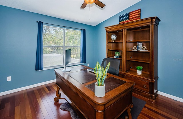 home office with vaulted ceiling, dark wood-type flooring, and ceiling fan