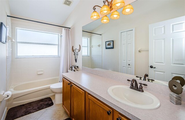 full bathroom featuring tile patterned flooring, vanity, shower / bath combination with curtain, and toilet