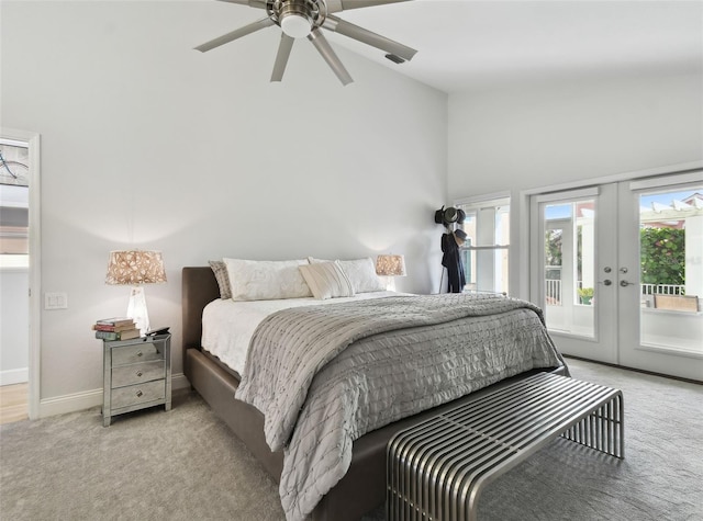 carpeted bedroom with high vaulted ceiling, ceiling fan, access to outside, and french doors