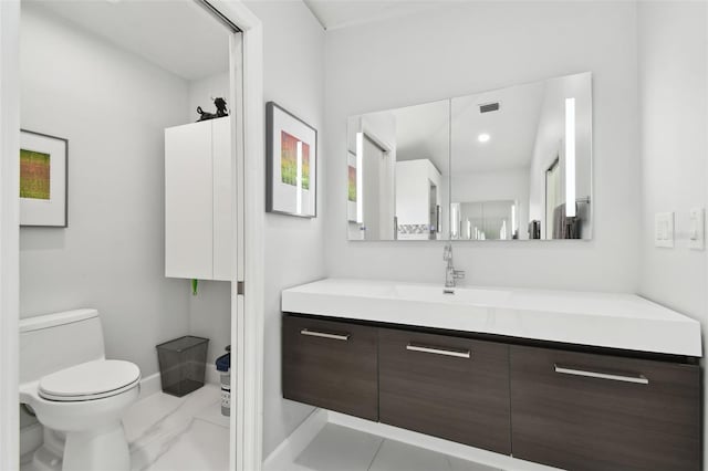 bathroom with vanity and toilet