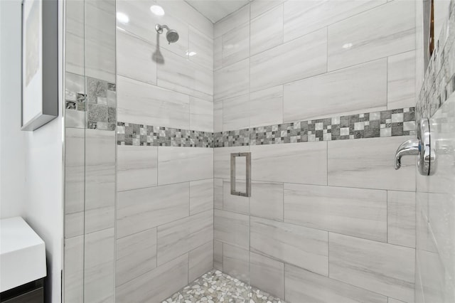 bathroom with tiled shower