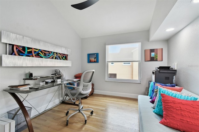 office area featuring light hardwood / wood-style floors and vaulted ceiling