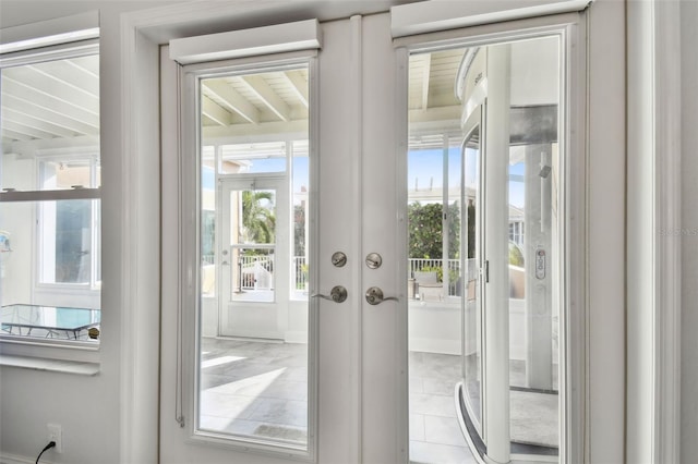 entryway featuring french doors and a healthy amount of sunlight