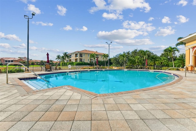 view of swimming pool featuring a patio area