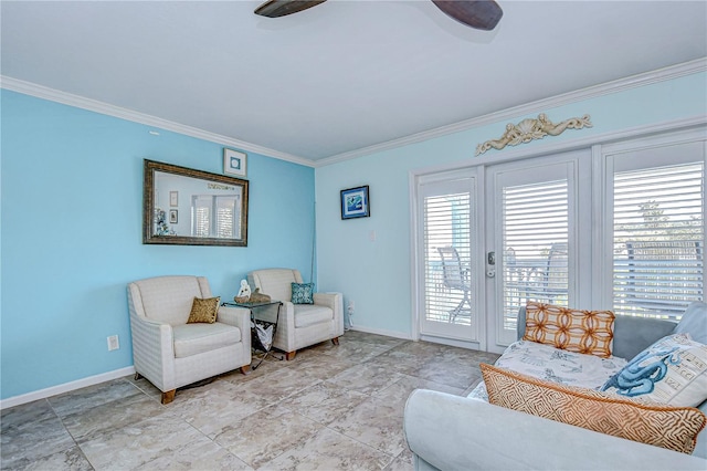 sitting room featuring plenty of natural light and ornamental molding