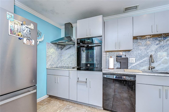 kitchen with black appliances, decorative backsplash, wall chimney range hood, and sink