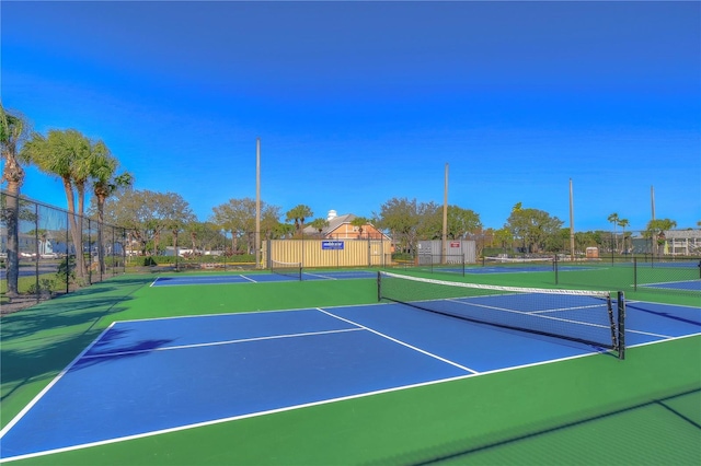 view of tennis court featuring basketball court