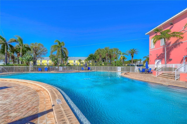 view of swimming pool featuring a patio area