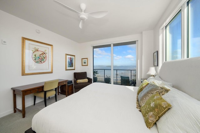 bedroom featuring access to outside, ceiling fan, carpet flooring, and a water view