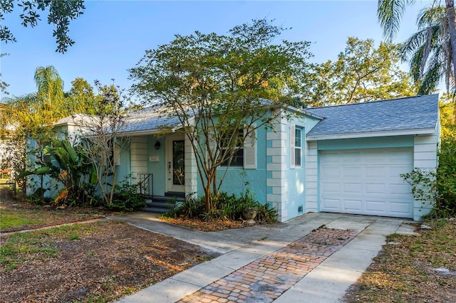 2932 W Alline Ave, Tampa, FL 33611 - single story home featuring concrete driveway, a garage, and roof with shingles