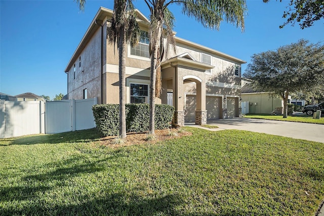 view of front of house featuring a garage and a front yard