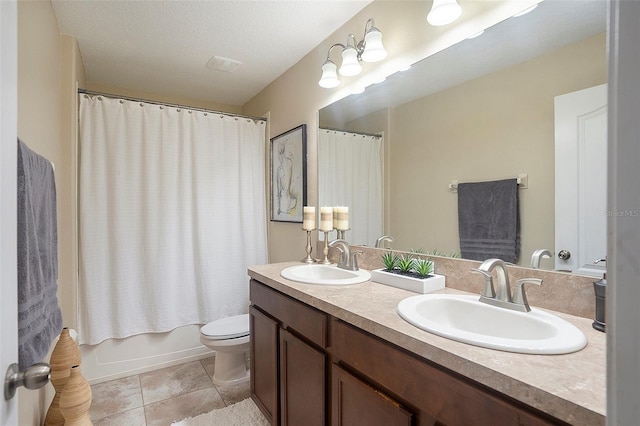 full bathroom with shower / bath combination with curtain, toilet, a textured ceiling, and vanity