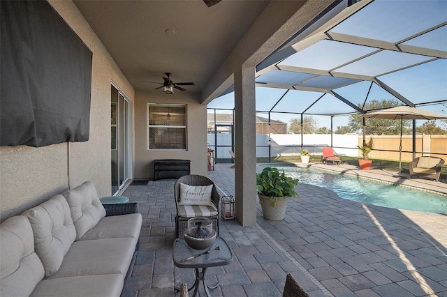 view of patio with ceiling fan, a lanai, and a fenced in pool