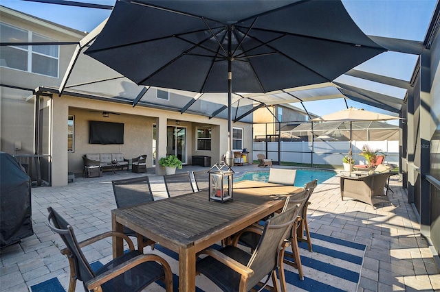 view of patio with a fenced in pool, an outdoor living space, and ceiling fan