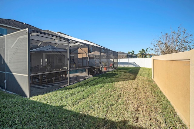 view of yard featuring a lanai and a fenced in pool