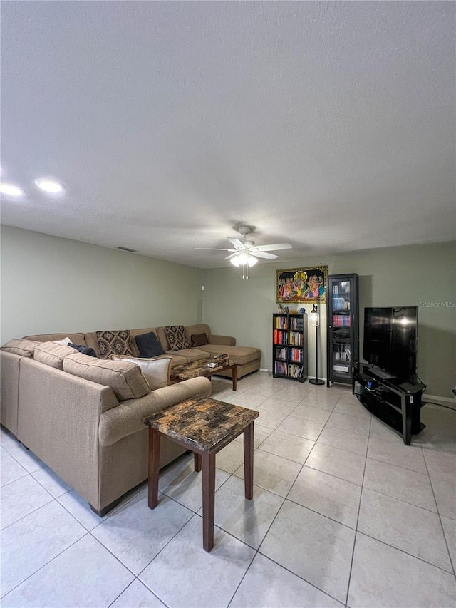 tiled living room featuring ceiling fan