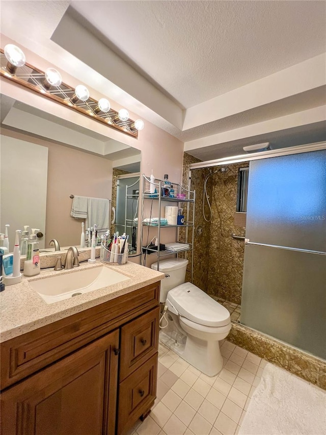 bathroom with walk in shower, vanity, tile patterned flooring, and toilet