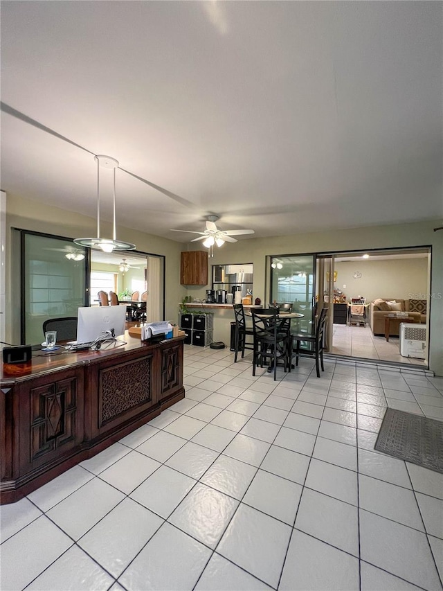 kitchen featuring ceiling fan and light tile patterned flooring