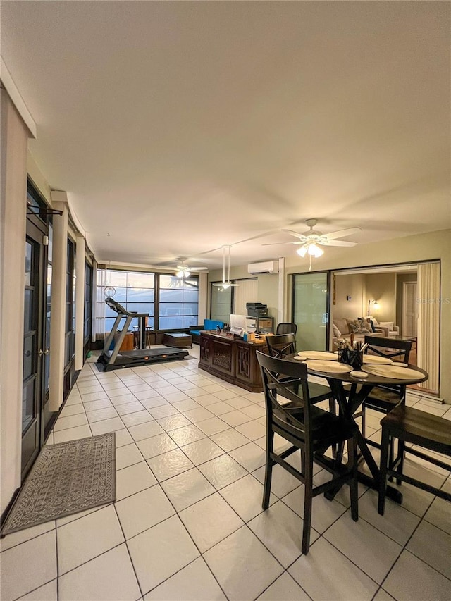 dining area with ceiling fan, light tile patterned floors, and an AC wall unit