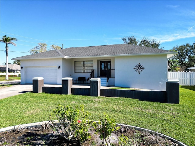 ranch-style home with a front yard and a garage