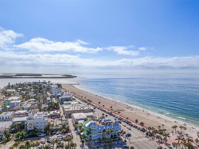 birds eye view of property featuring a beach view and a water view